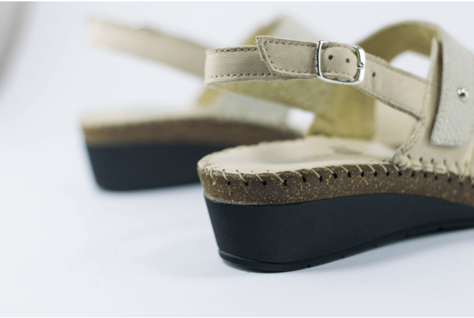 Beige ladies' sandals with a buckle